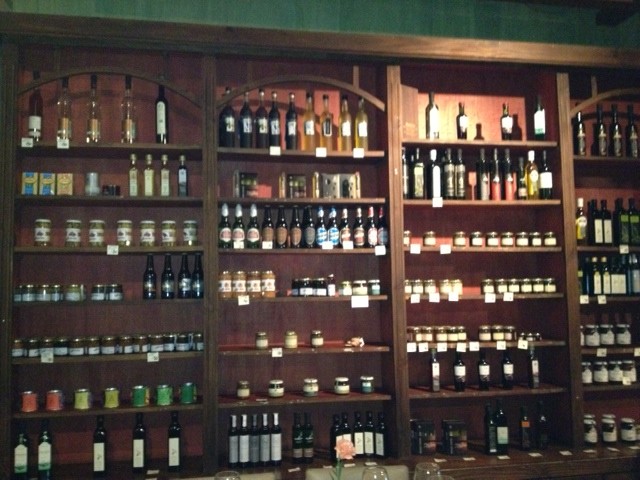 Wines and spices on shelves in restaurant in Mendoza